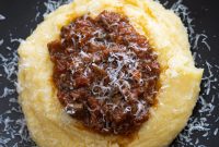Sausage and Mushroom Ragu over Creamy Polenta