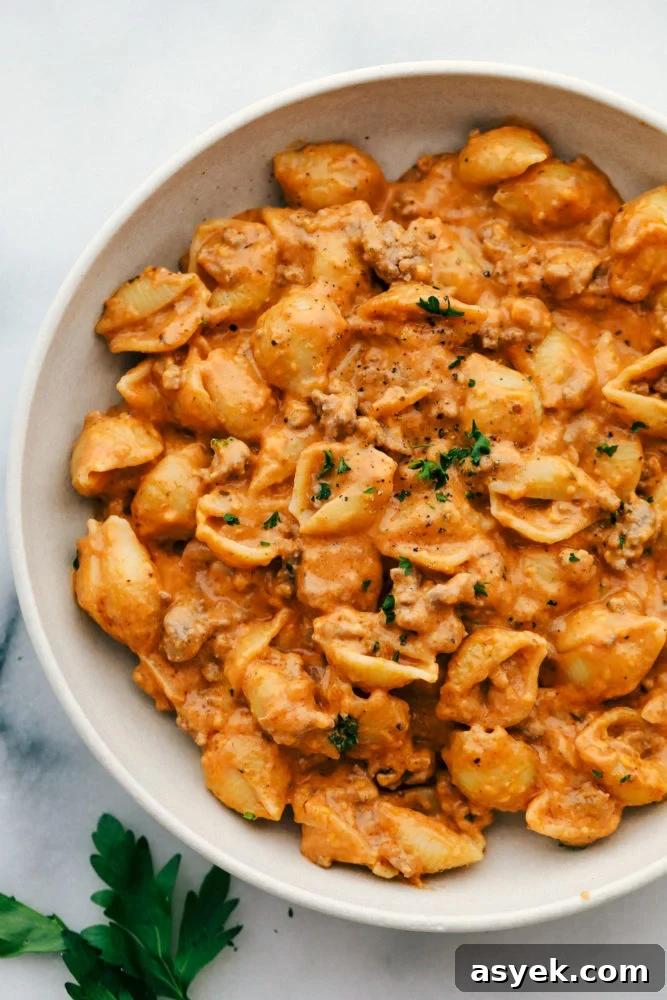 Cheesy beef and shells in a bowl. 