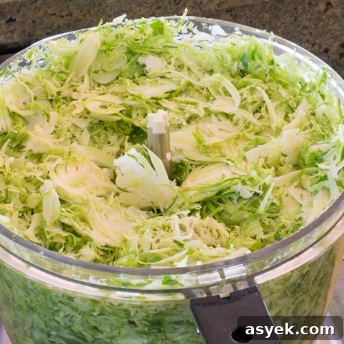 Thinly shaved Brussels sprouts ready to be cooked.