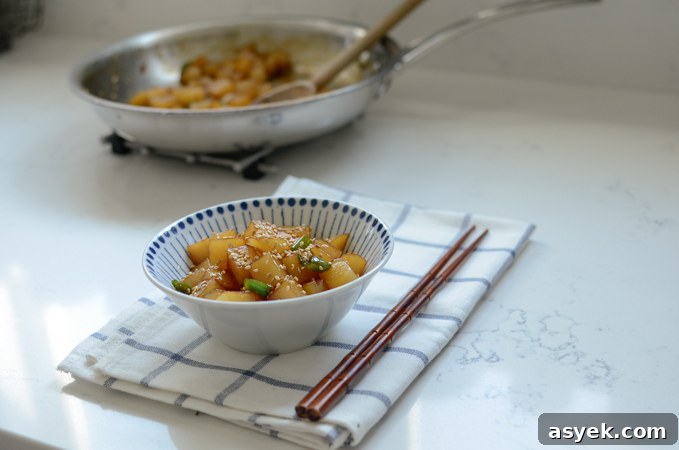 Korean Braised Potatoes (Gamja Jorim) Recipe 9 Gamja Jorim, Korean braised potato side dish, served in a bowl.