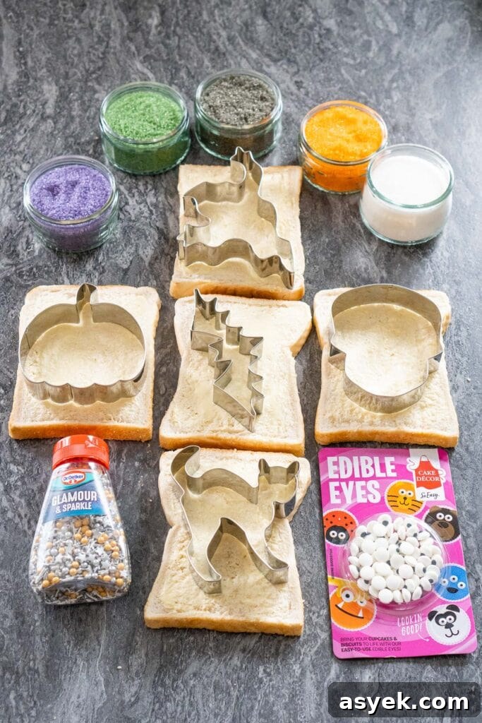 Four glass ramekins with white, green, orange, black and purple sugar inside them, five slices of white bread with Halloween cutters on each slice, sprinkles and edible eyes on the side