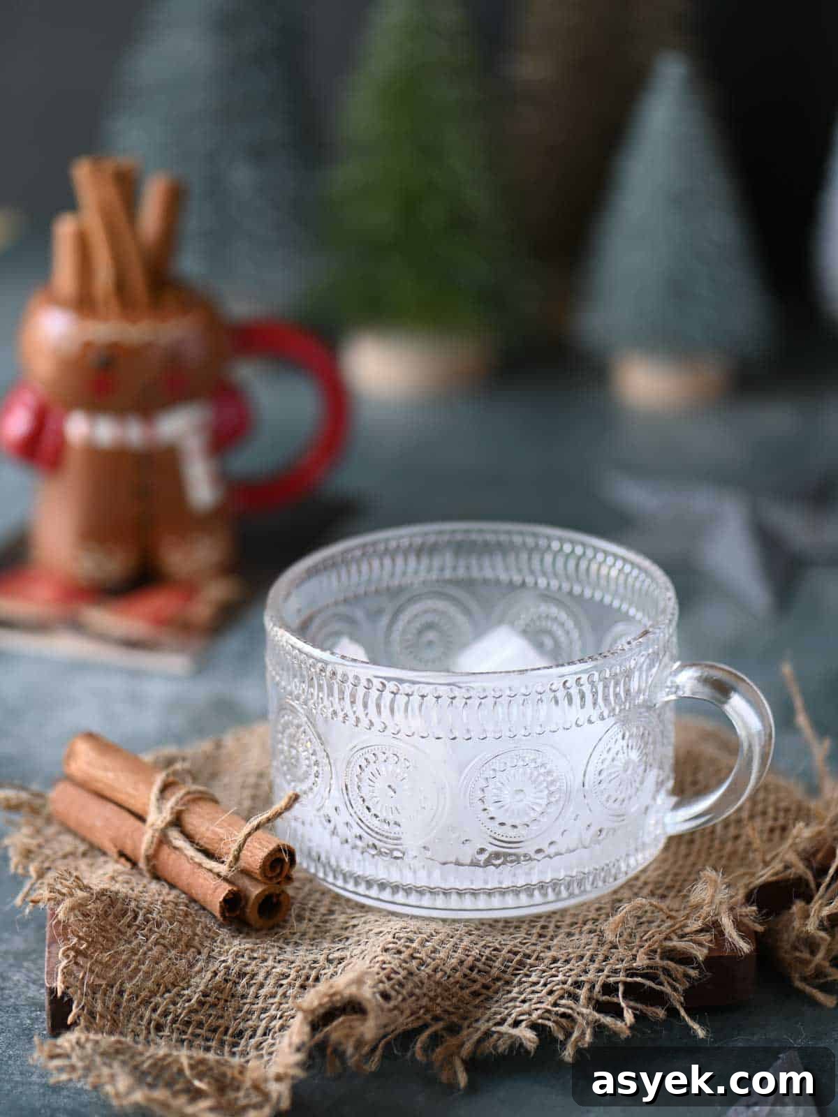 Festive Eggnog White Russian Cocktail Recipe 4 Ice in a clear glass on burlap.