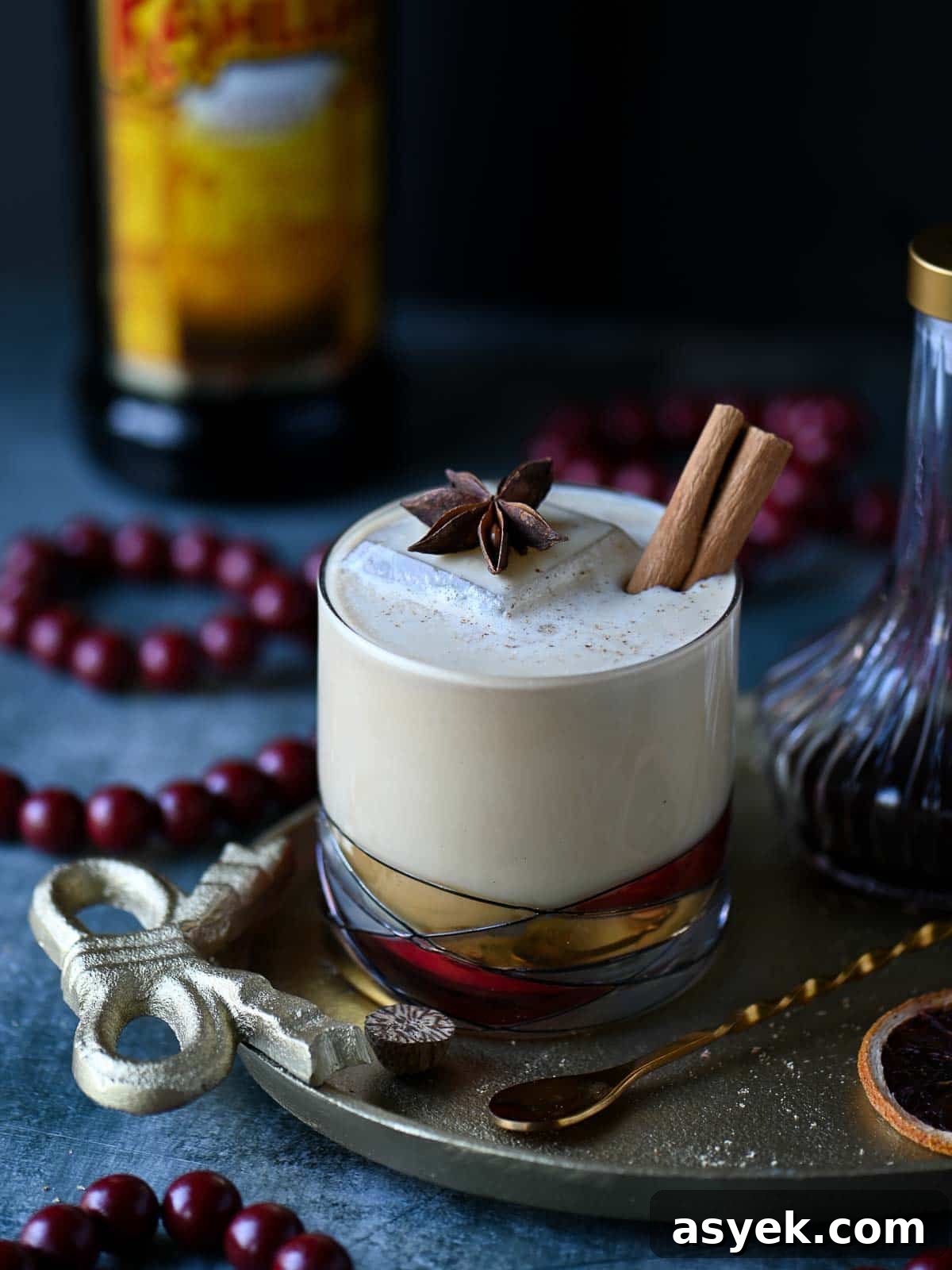 Festive Eggnog White Russian Cocktail Recipe 8 White Russian in a clear glass on a gold tray.