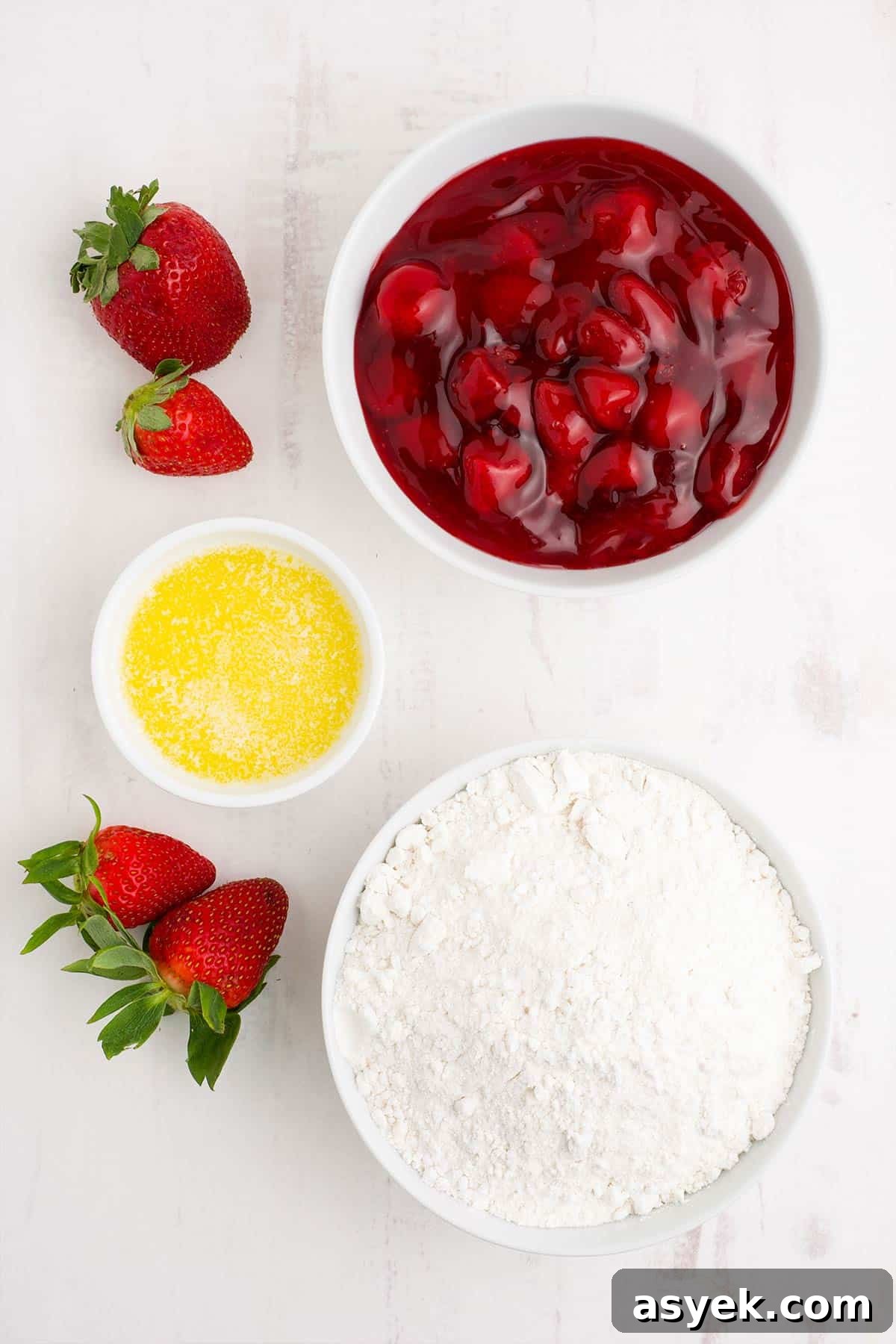 Ingredients to make strawberry dump cake on the counter.