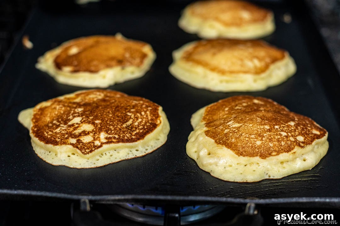 Banana Pancakes Cooking on Griddle