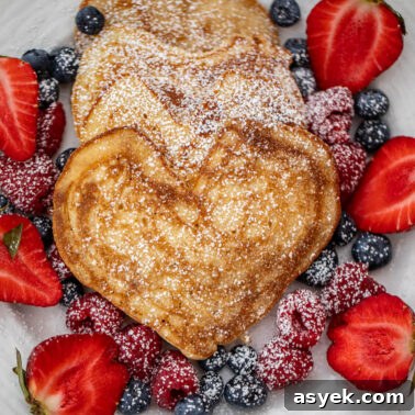 Square image of heart pancakes.