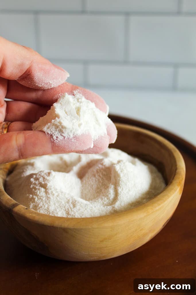 Almond Flour Substitutes: 10 Alternatives and How to Use Them 7 brown bowl of sweet rice flour with a hand holding.