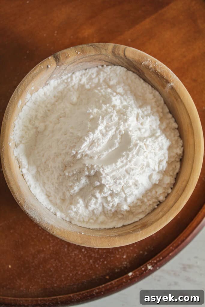 Almond Flour Substitutes: 10 Alternatives and How to Use Them 8 overhead shot of a wooden bowl of tapioca starch.