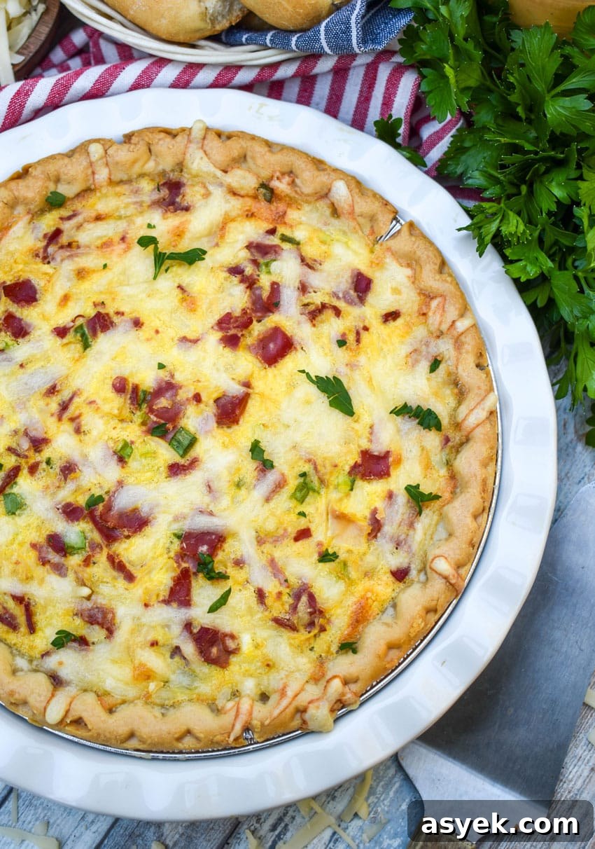 Reuben Quiche Recipe: Corned Beef, Swiss and Sauerkraut 2 a baked reuben quiche in a white pie plate