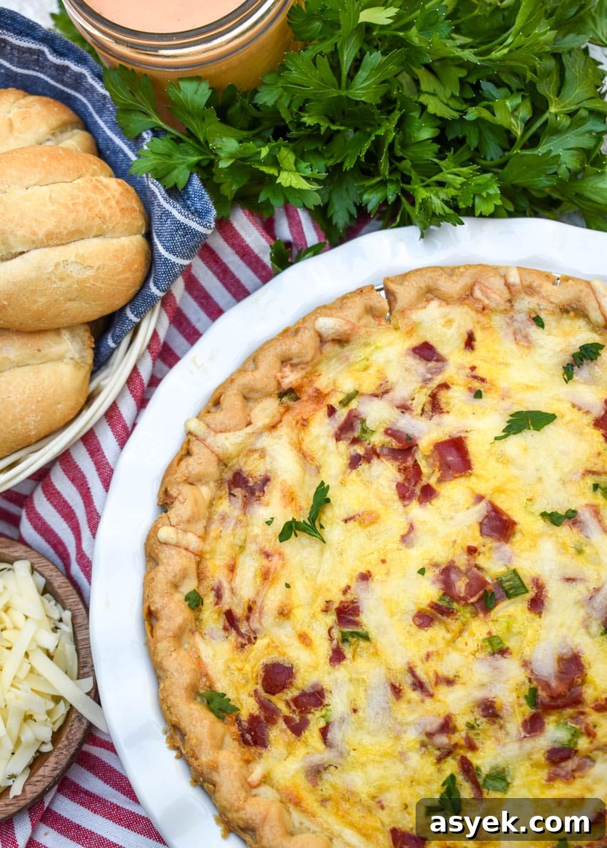 Reuben Quiche Recipe: Corned Beef, Swiss and Sauerkraut 3 a baked reuben quiche in a white pie plate