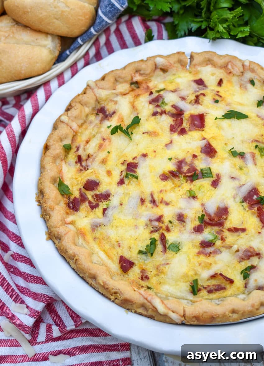 Reuben Quiche Recipe: Corned Beef, Swiss and Sauerkraut 4 a baked reuben quiche in a white pie plate