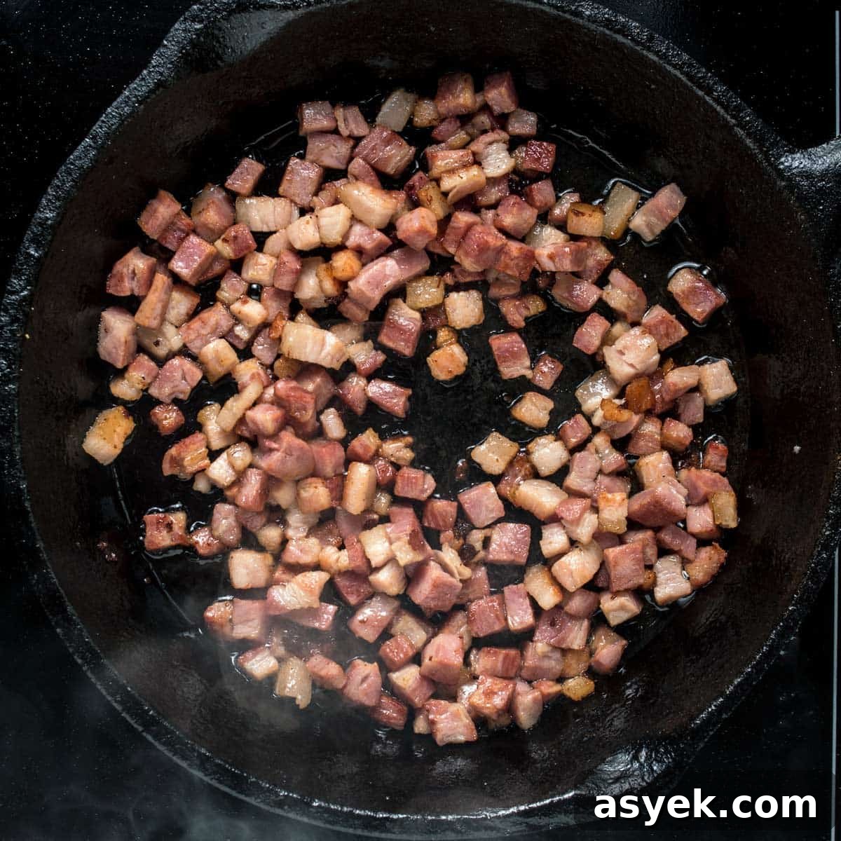 Cooking the bacon for haluski in a skillet.