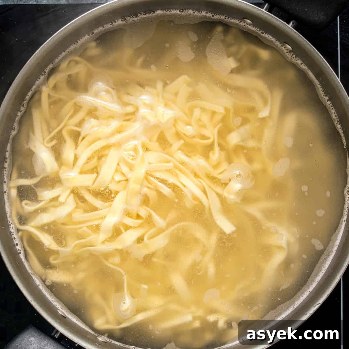 Cooking noodles for fried cabbage and noodles recipe.