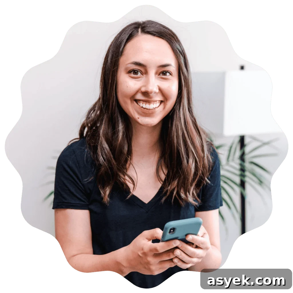 Kayla Burton from Broken Oven Baking Company holding a phone.