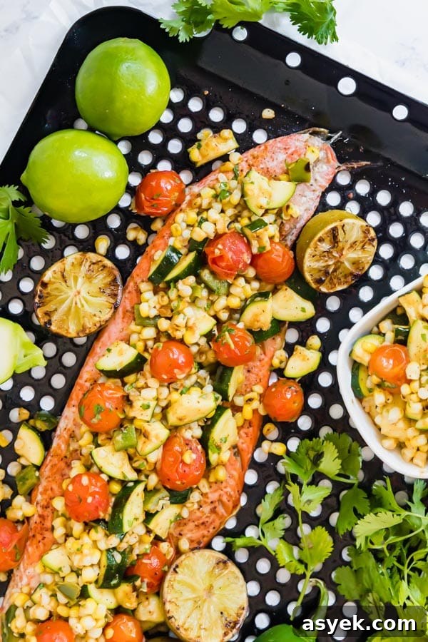 A closer overhead image of a portion of salmon on the pan.