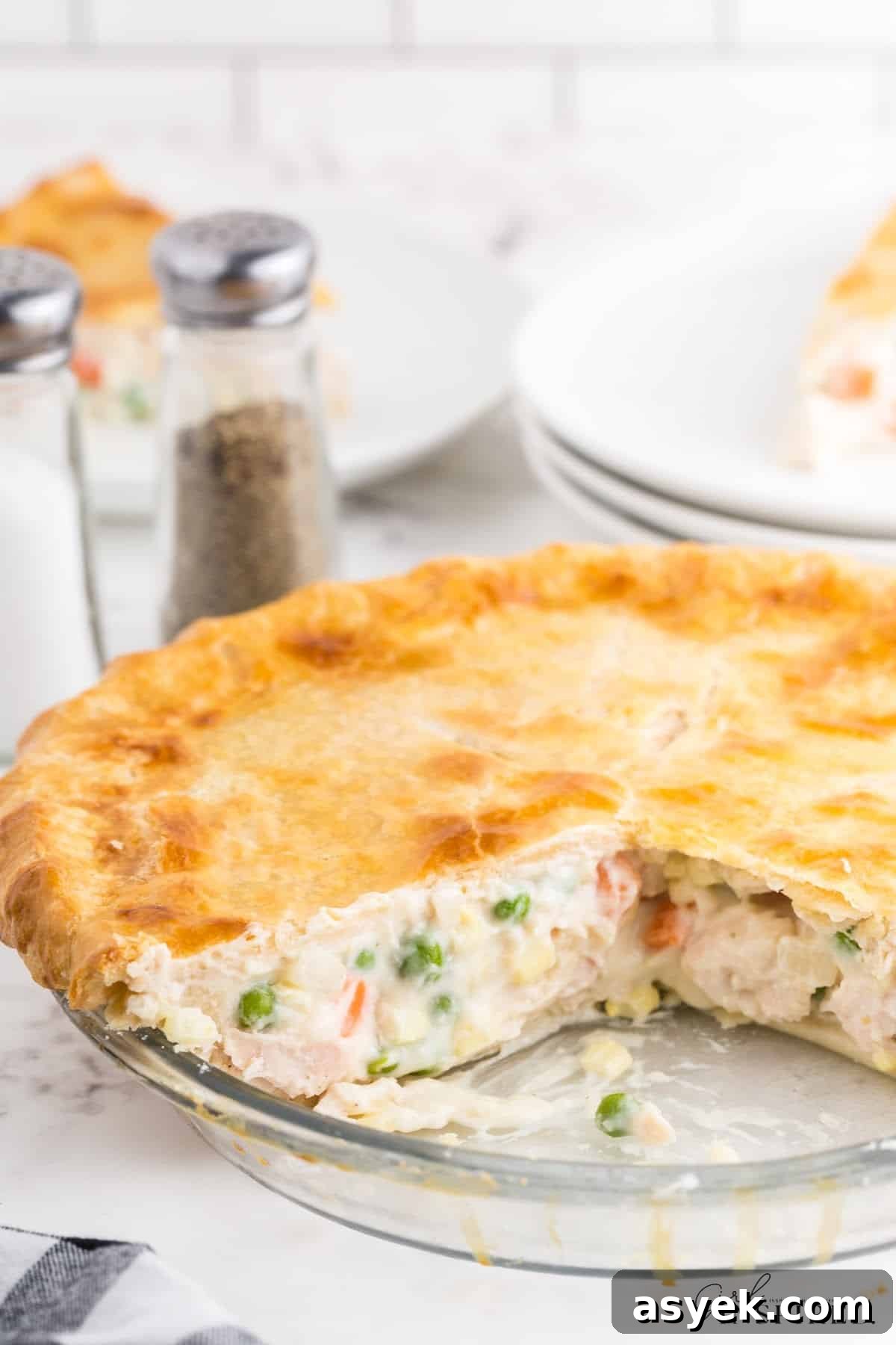 Chicken pot pie with a slice out of the dish.