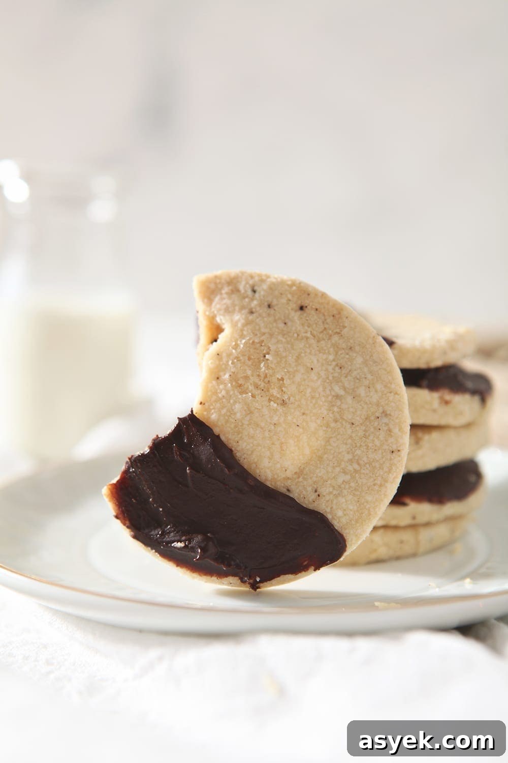 Irresistible Brown Butter Shortbread Cookies Recipe 3 A Shortbread Brown Butter Cookie with a bite taken out of it on a white plate