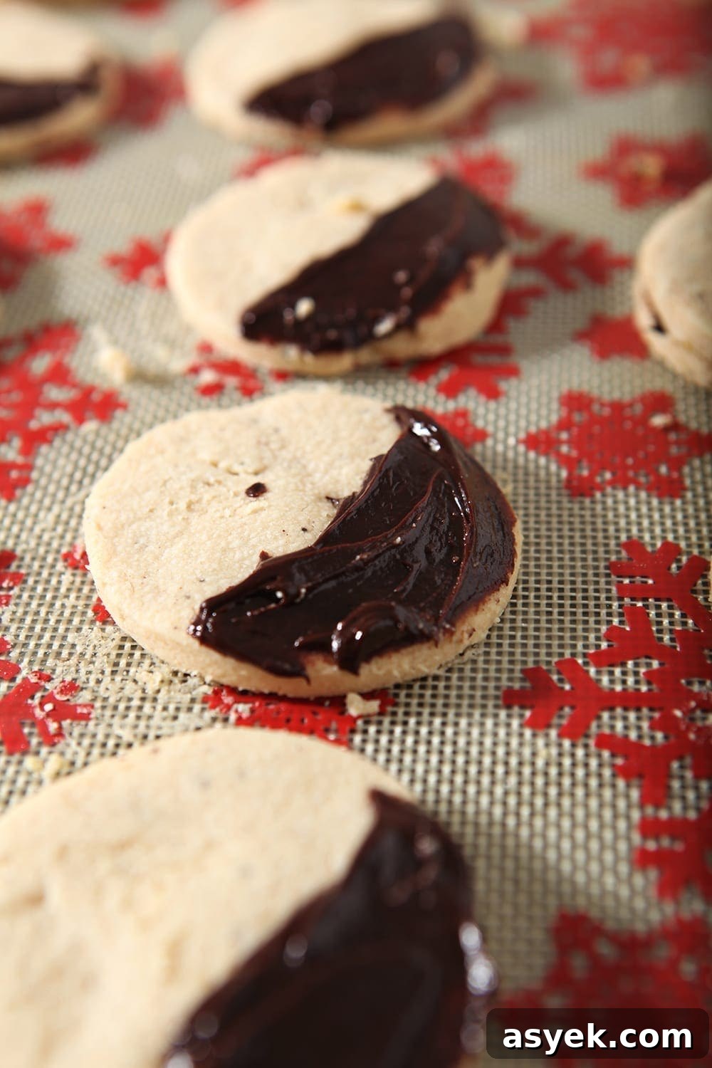 Irresistible Brown Butter Shortbread Cookies Recipe 7 Shortbread cookies, slathered with a ganache, sit on a baking sheet