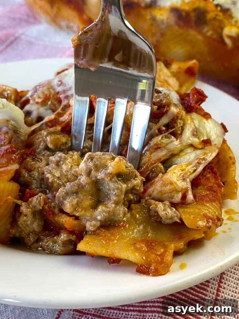 Fork in creamy, cheesy, ground beef stuffed shell