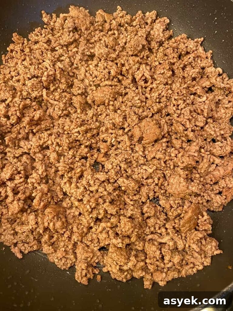 Browned and drained ground beef in a skillet