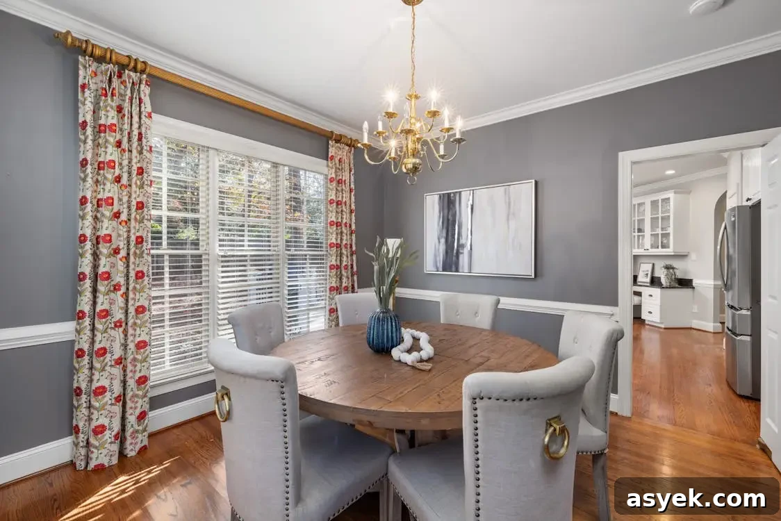 Window Treatments That Define Modern Interiors 3 Dining room with round wooden table, gray chairs, floral curtains, and gold chandelier in bright setting