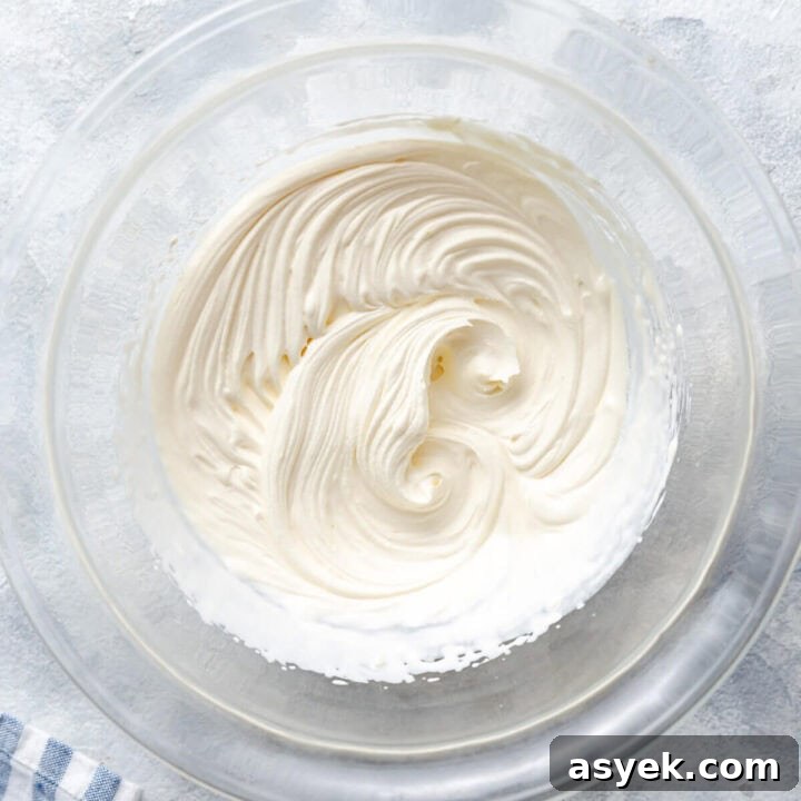 Creamy No-Bake Pumpkin Cheesecake Recipe 7 overhead shot of a bowl with whipped cream
