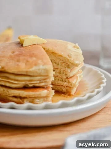 A portion of the bisquick banana pancake stack is missing.