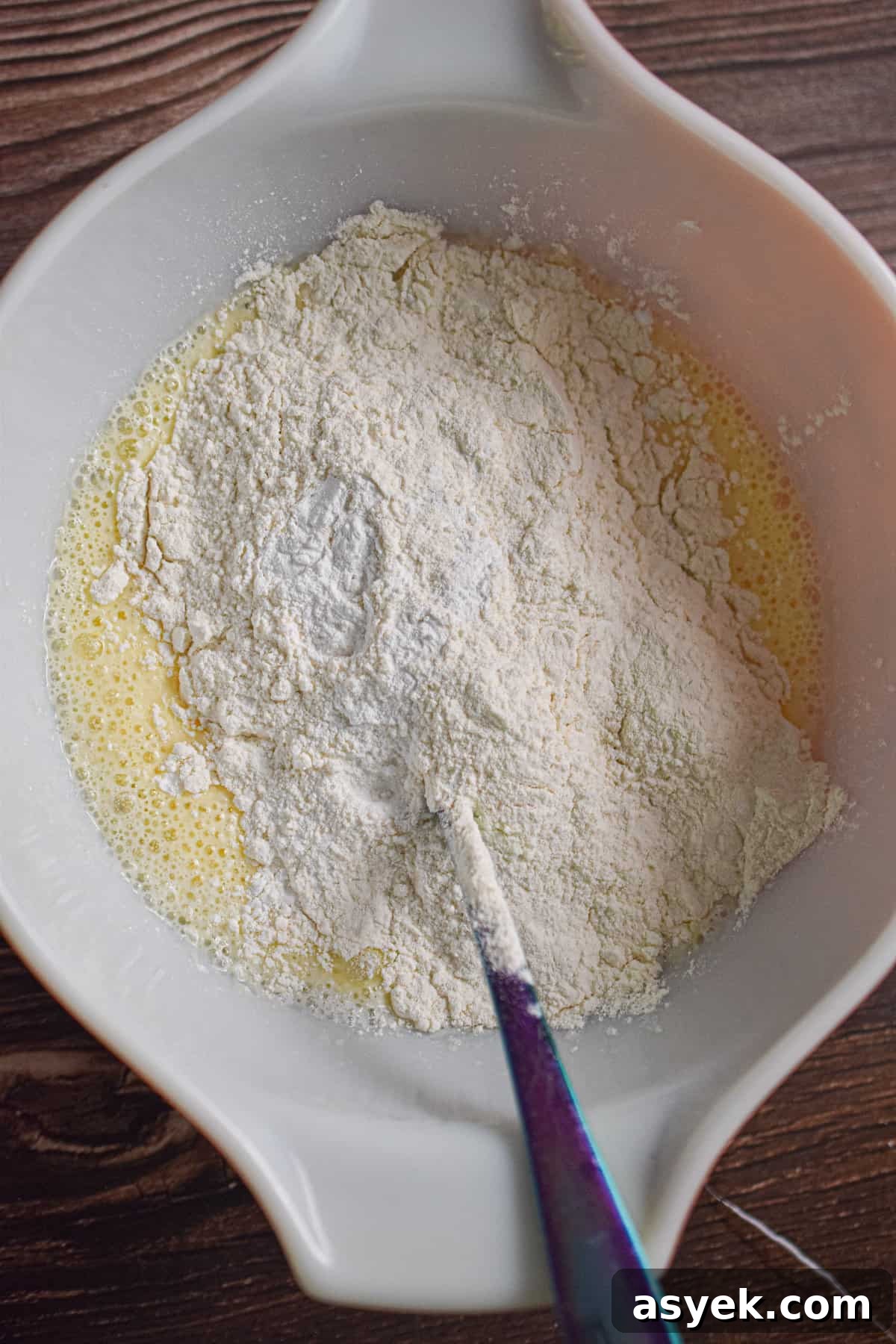 The dry ingredients are added to the wet ingredients.