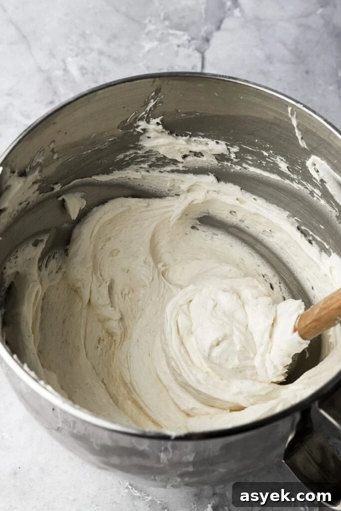 Fudgy Chocolate Brownie Cake Recipe 12 cream cheese frosting finished in a bowl