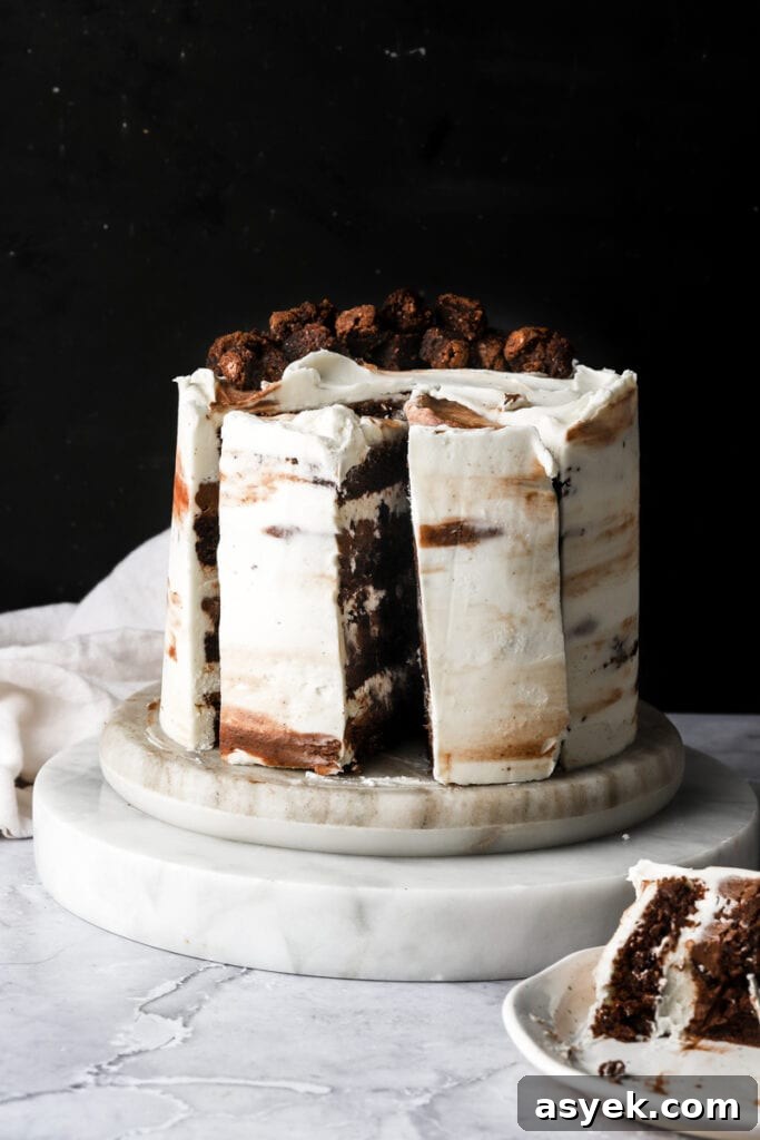 Fudgy Chocolate Brownie Cake Recipe 4 cake frosted with white frosting and brownies on top