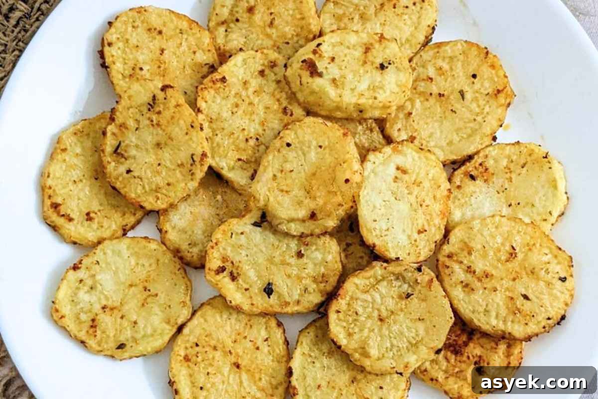 Crispy Air Fryer Potato Slices 2 Close up of potato slices on a plate