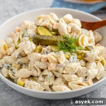 A bowl filled with Dill Pickle Pasta Salad.