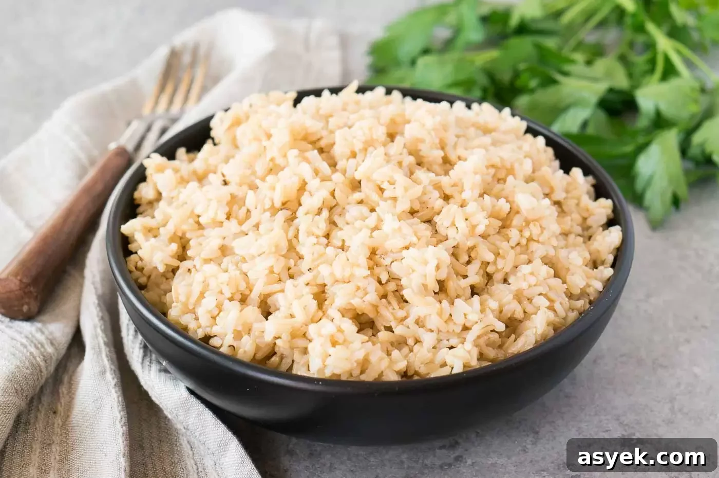 Fluffy Instant Pot Brown Rice in 20 Minutes 3 instant pot brown rice in a black bowl