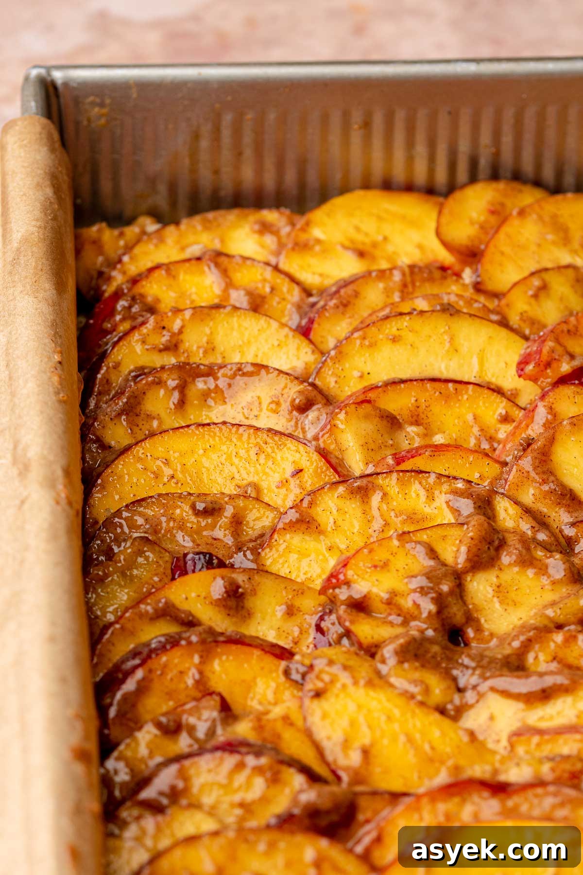 Brown Butter Peach Crumble Bars Recipe 11 Peach slices layered onto shortbread.
