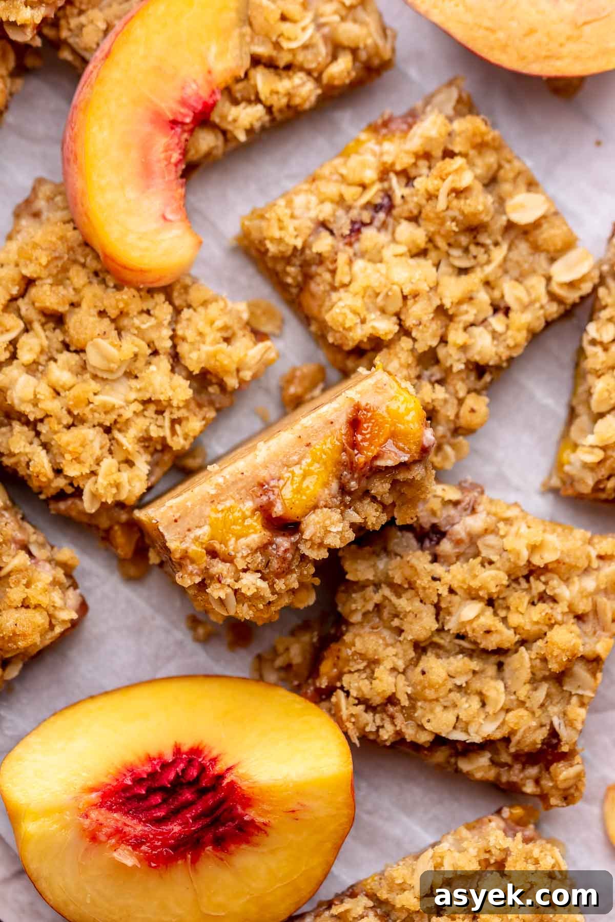 Brown Butter Peach Crumble Bars Recipe 12 A slice of peach crumble bars sliced laying on its side.