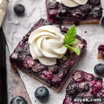 Brown Butter Peach Crumble Bars Recipe 15 Blueberry pie bar squares with whipped cream and mint springs.