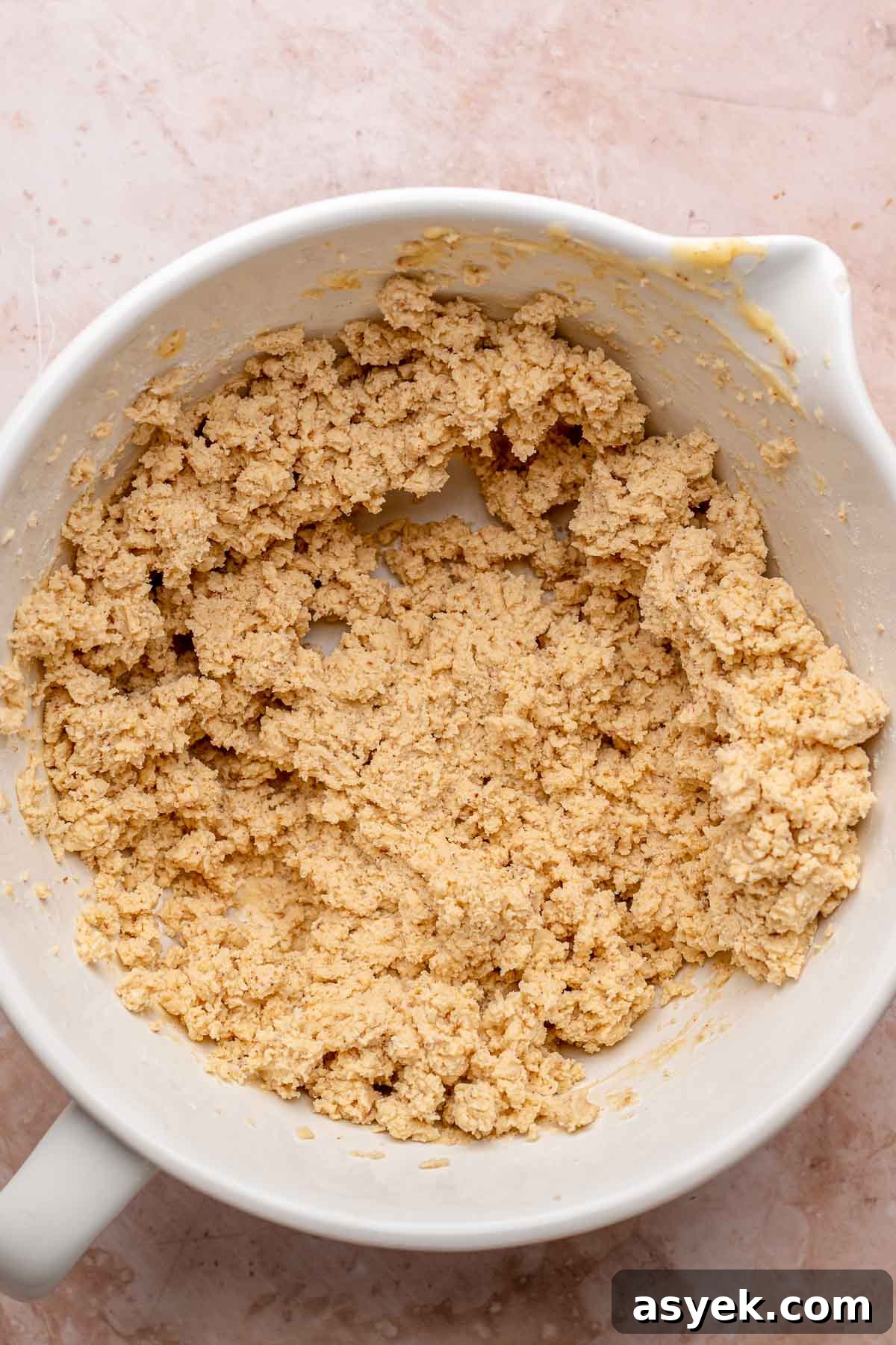 Brown Butter Peach Crumble Bars Recipe 6 Brown butter shortbread dough in a bowl.
