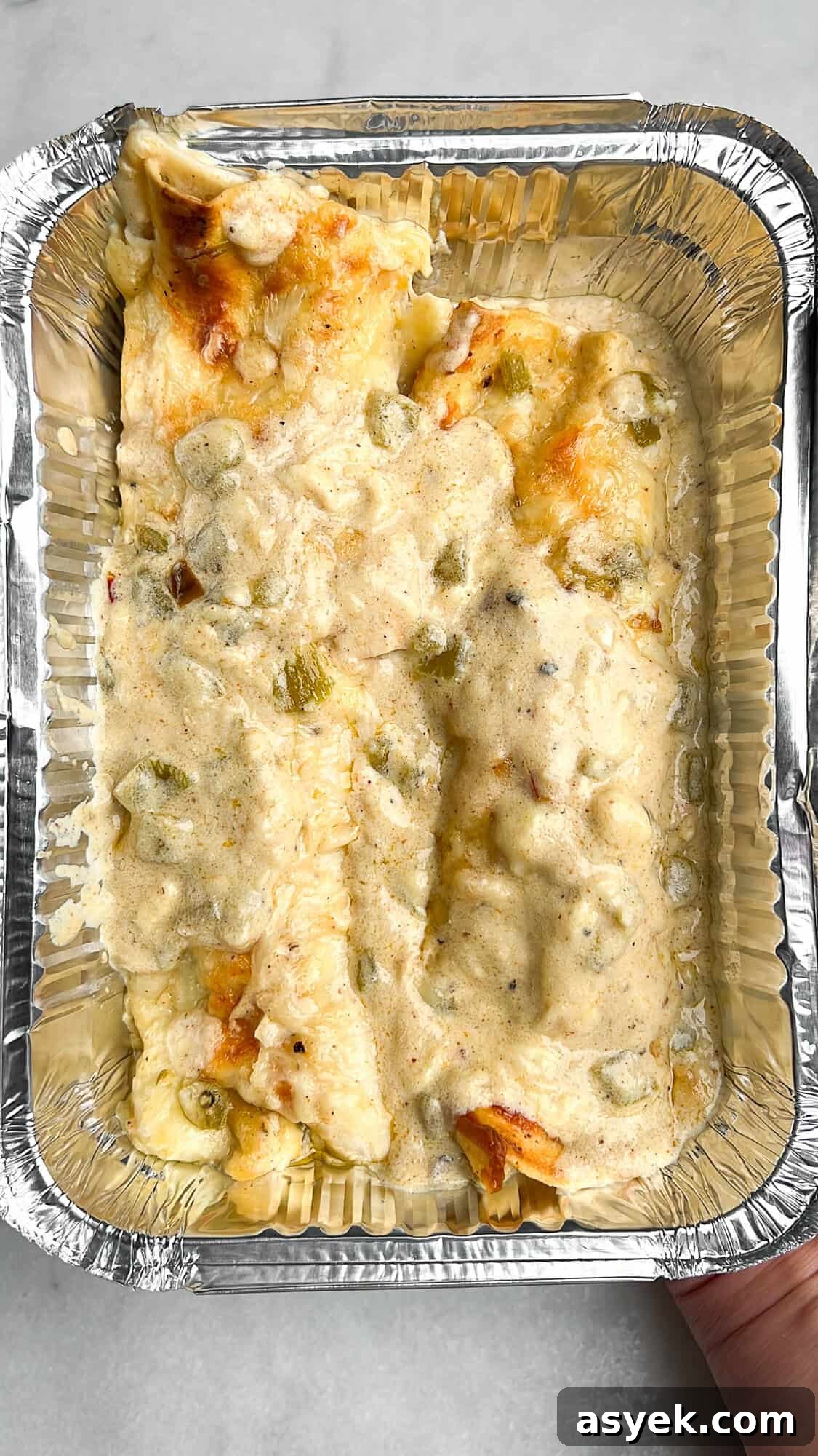 freezer-friendly enchiladas in a foil container