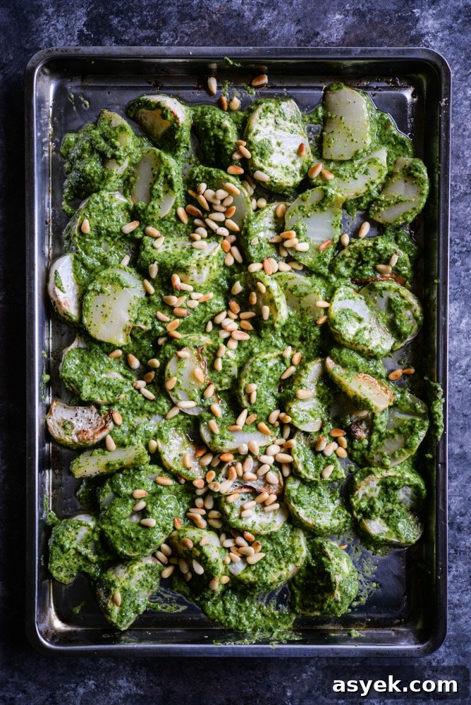 Take plain roasted turnips to the next level by tossing them in this lemon & garlic turnip greens pesto for a new spin on the classic root vegetable! | Fed & Fit