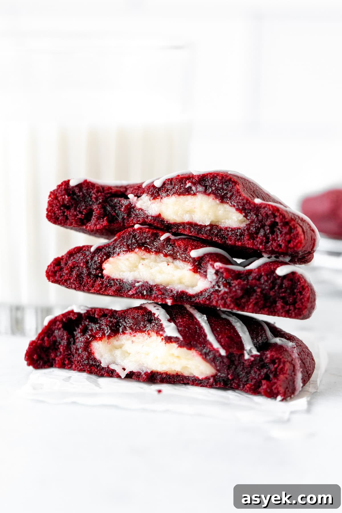 Red Velvet Cookies with Cream Cheese Filling 2 Stack of three half red velvet cheesecake cookies