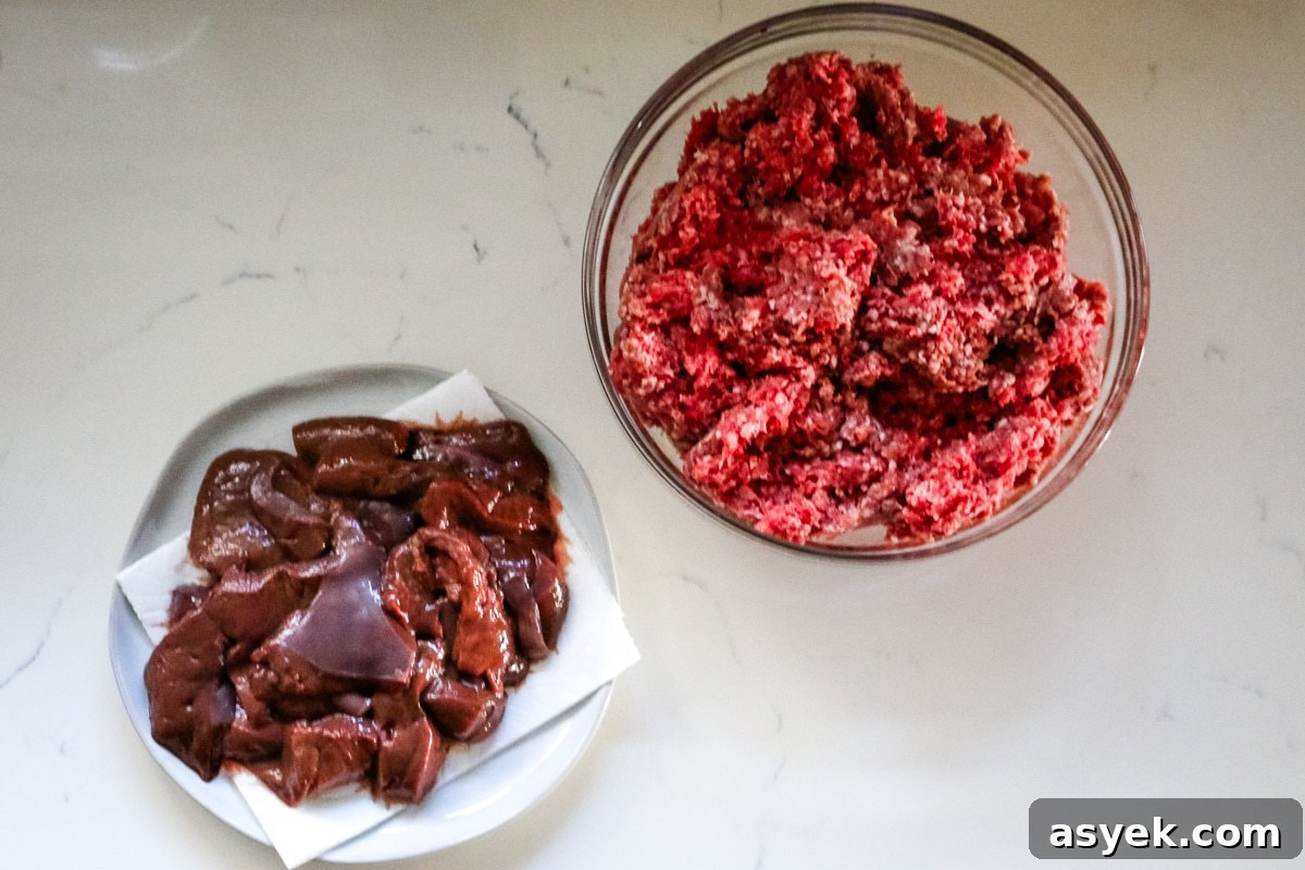 Ground beef in a clear bowl and liver on a white plate.