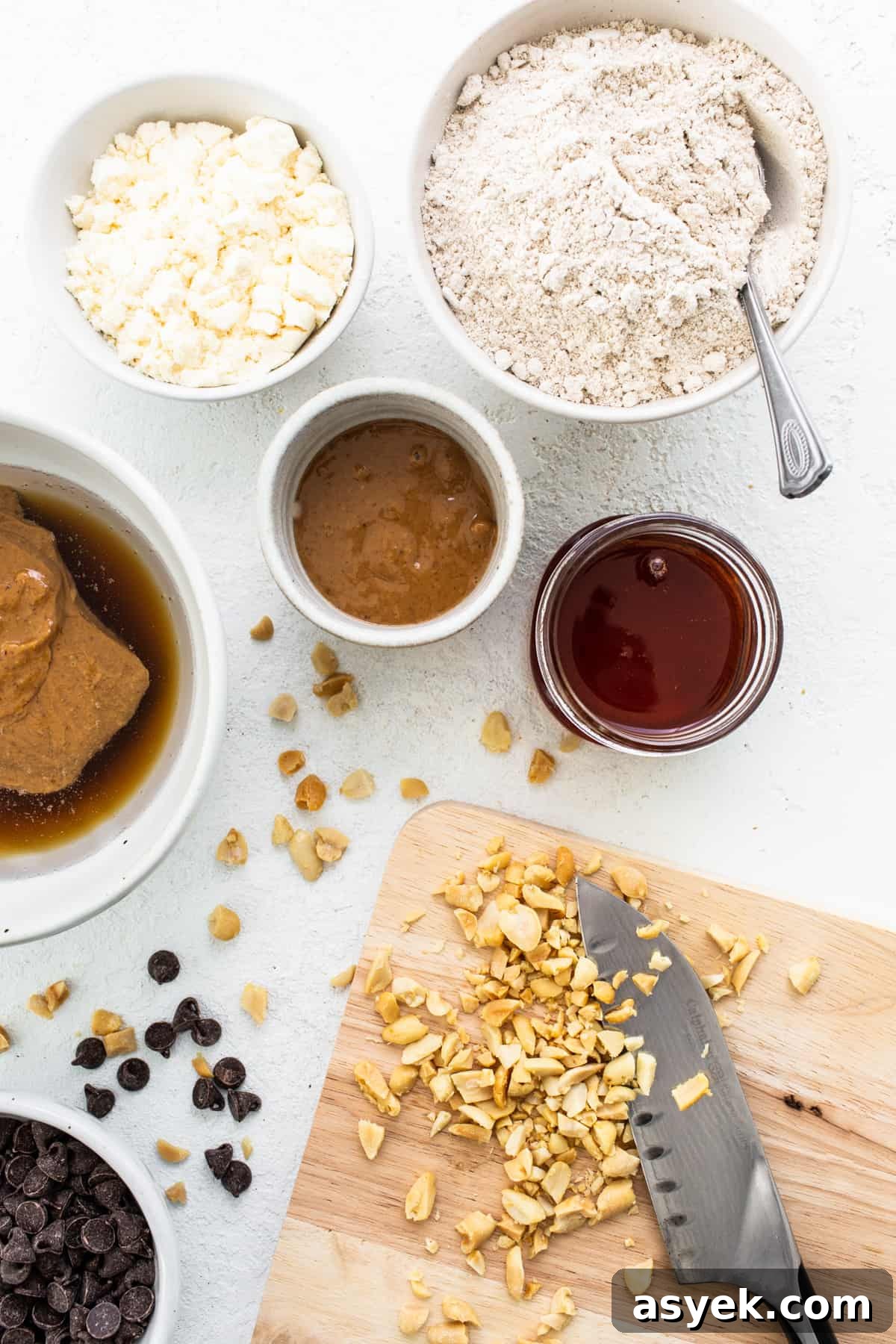 Ingredients for peanut butter cookie dough on a cutting board.