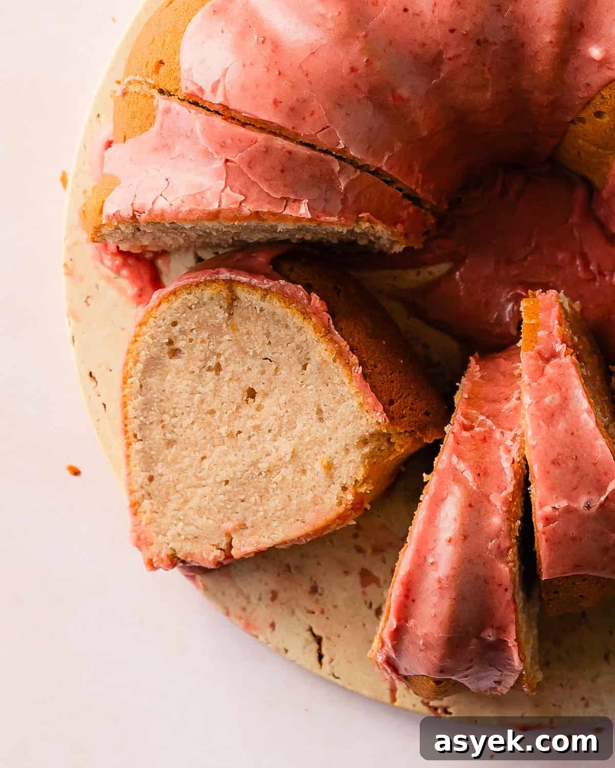 Strawberry pound cake is a buttery, moist, dense and tender pound cake made with fresh strawberries. Top with this pound cake with fresh strawberries with a sweet and creamy fresh strawberry icing. Enjoy this easy to make, strawberry filled classic pound cake for breakfast, brunch or dessert.