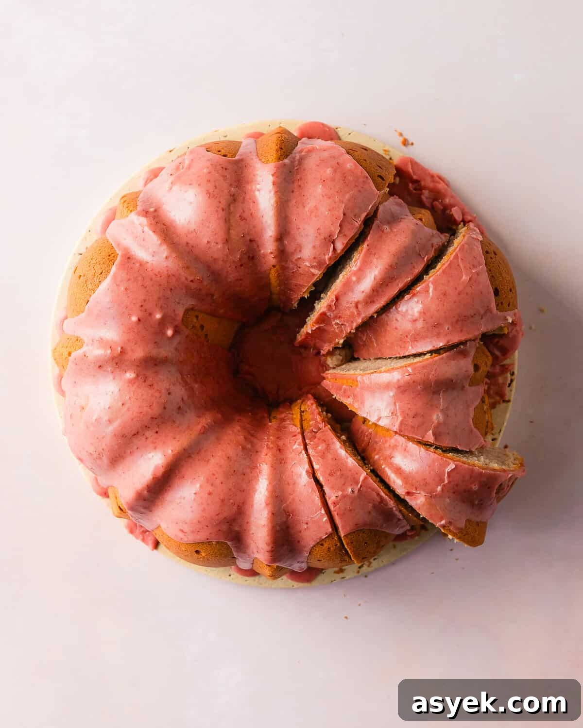 Strawberry pound cake is a buttery, moist, dense and tender pound cake made with fresh strawberries. Top with this pound cake with fresh strawberries with a sweet and creamy fresh strawberry icing. Enjoy this easy to make, strawberry filled classic pound cake for breakfast, brunch or dessert.