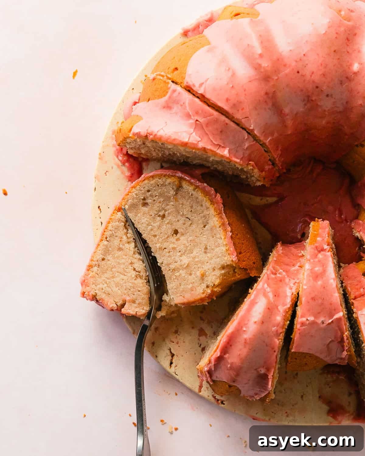 Strawberry pound cake is a buttery, moist, dense and tender pound cake made with fresh strawberries. Top with this pound cake with fresh strawberries with a sweet and creamy fresh strawberry icing. Enjoy this easy to make, strawberry filled classic pound cake for breakfast, brunch or dessert.