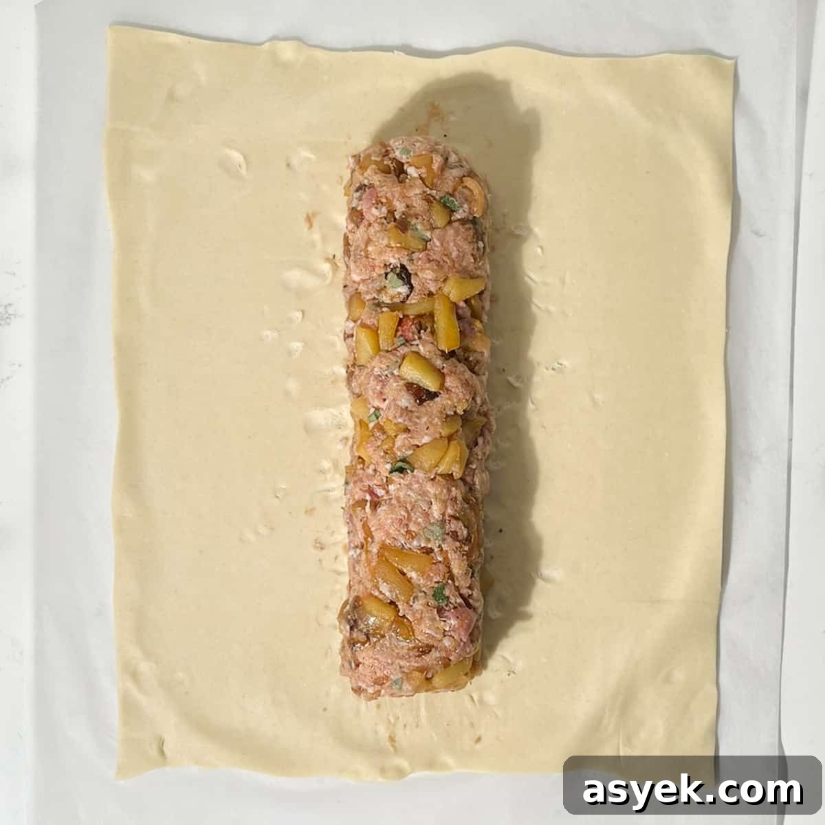 Shaping a sausage meat sausage for the sausage plait.