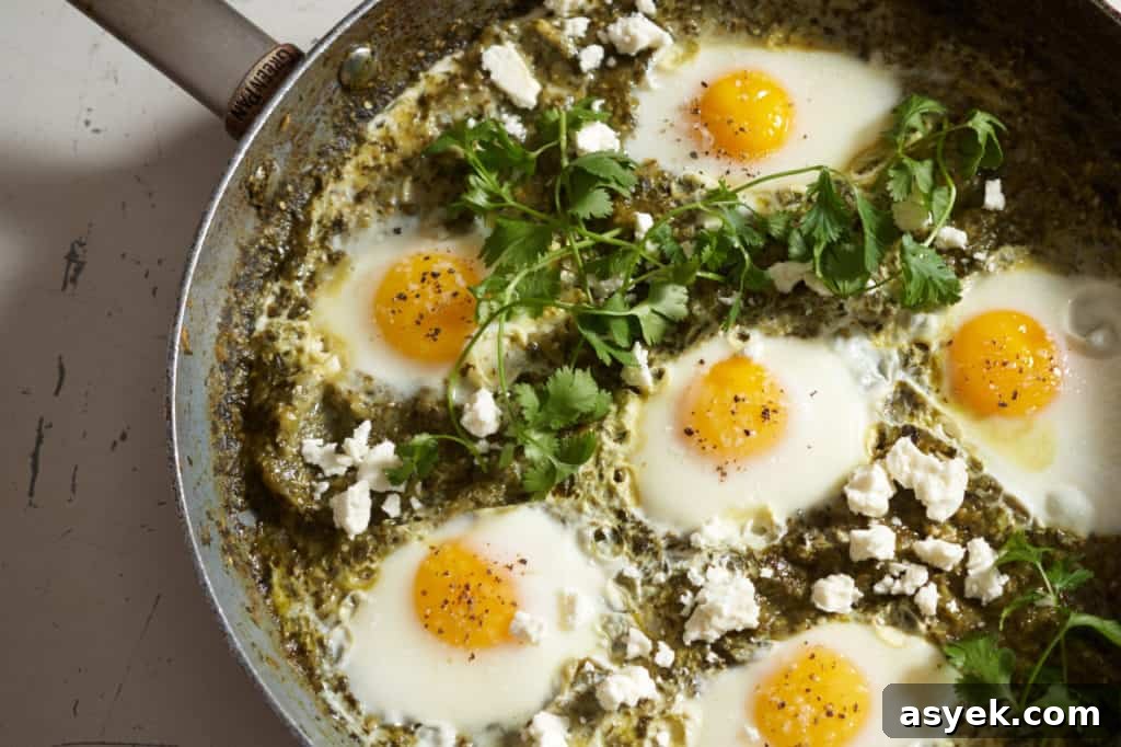 Green shakshuka topped with feta and garnished with fresh cilantro.