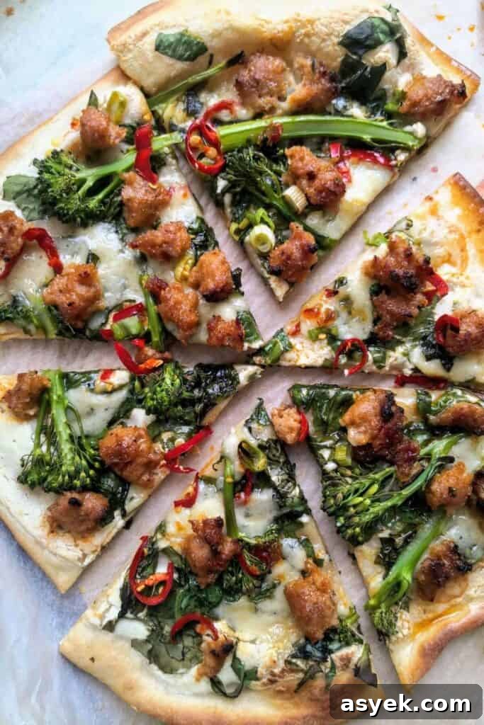 Pepperoni Focaccia Pizza Bread with Crispy Cheese Crust 18 Whipped ricotta, sausage, broccolini and chilli pizza sliced.