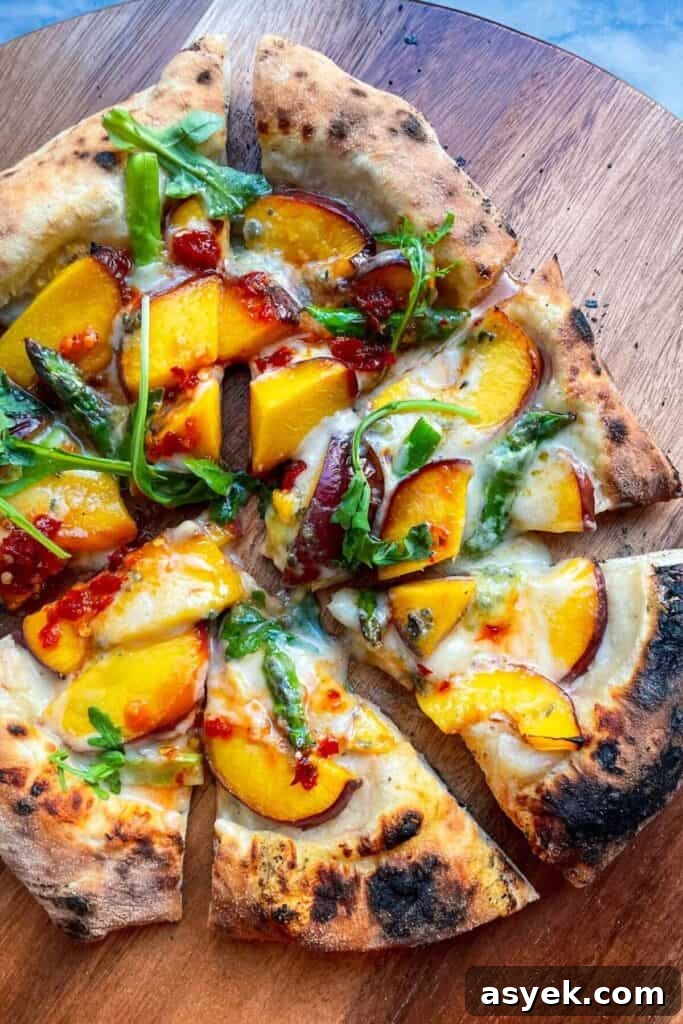 Pepperoni Focaccia Pizza Bread with Crispy Cheese Crust 19 Peach blue cheese pizza sliced on a wooden board.