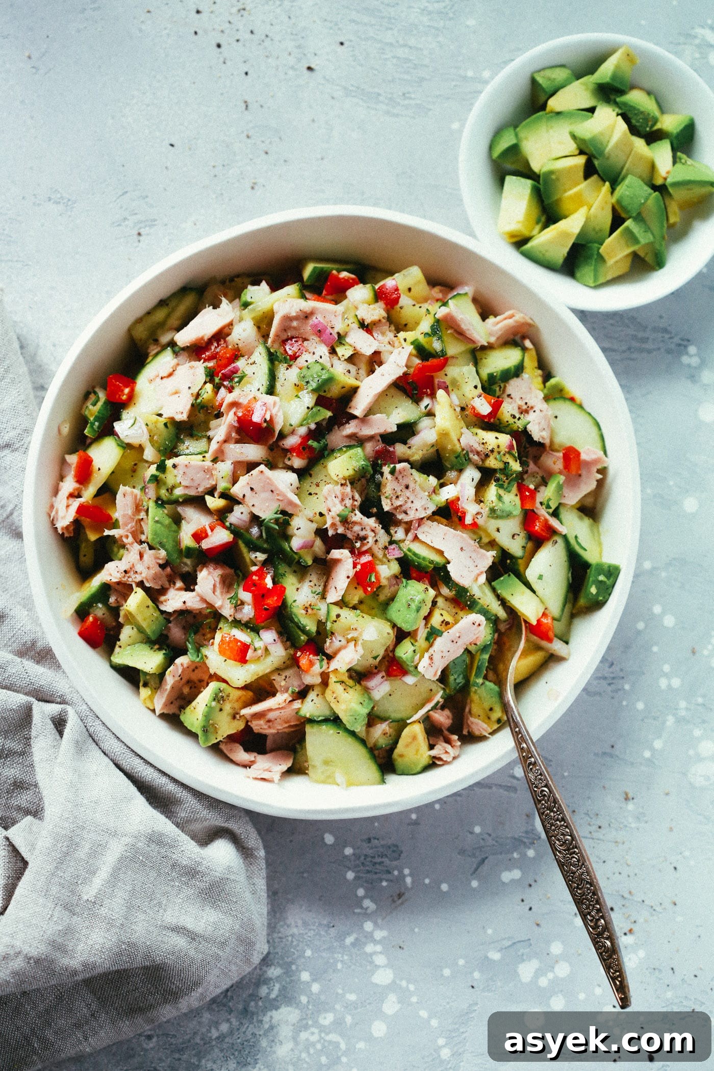 overhead view of Avocado Tuna Salad in a white bowl. 